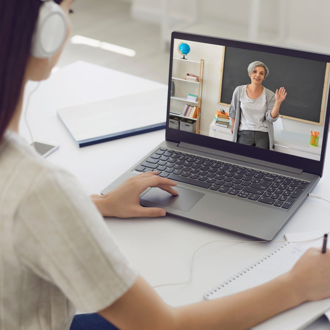 Woman talking with teacher on a video call